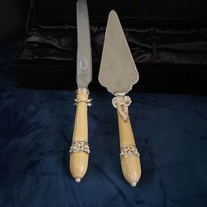 Wedding cake knife & server it has pearls on the handles.